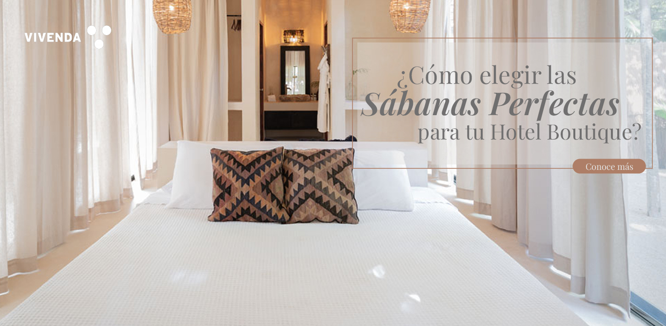 Cama blanca de hotel boutique con sábanas de algodón perfectamente tendidas, iluminación suave y sensación de limpieza y confort.