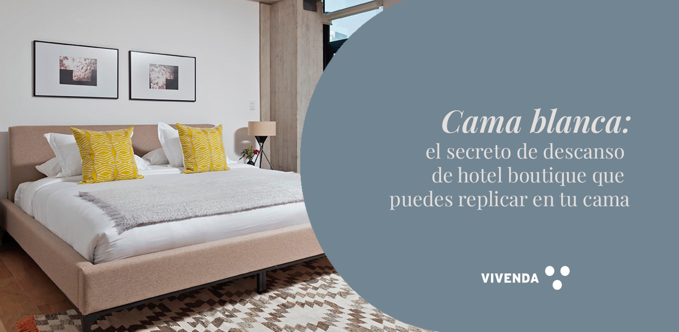 una cama blanca de hotel boutique bien tendida que invita al descanso