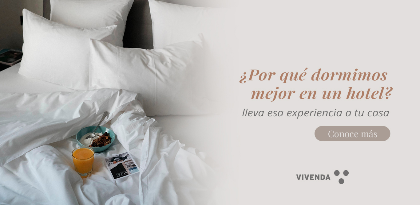 una cama con textiles de fibras naturales ideales para el descanso